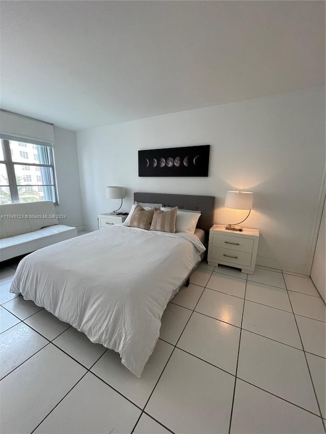 bedroom featuring light tile patterned flooring