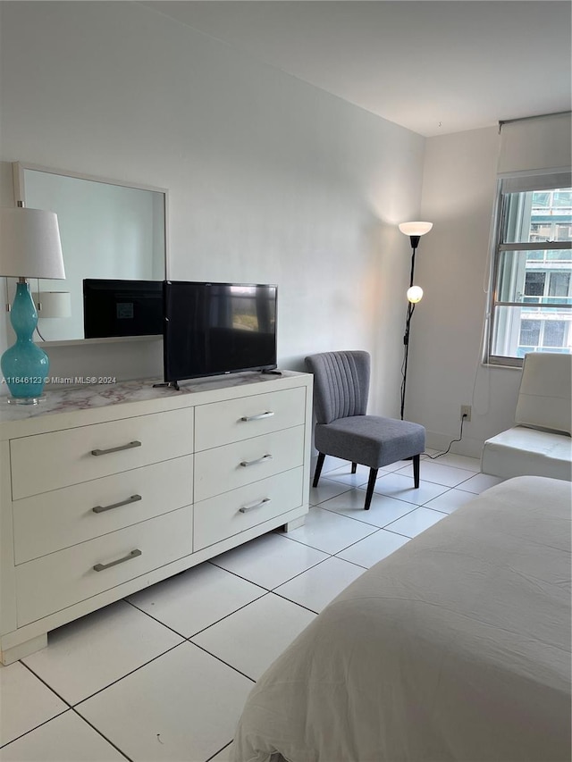 bedroom with light tile patterned flooring