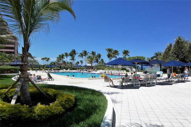 community pool featuring a patio area