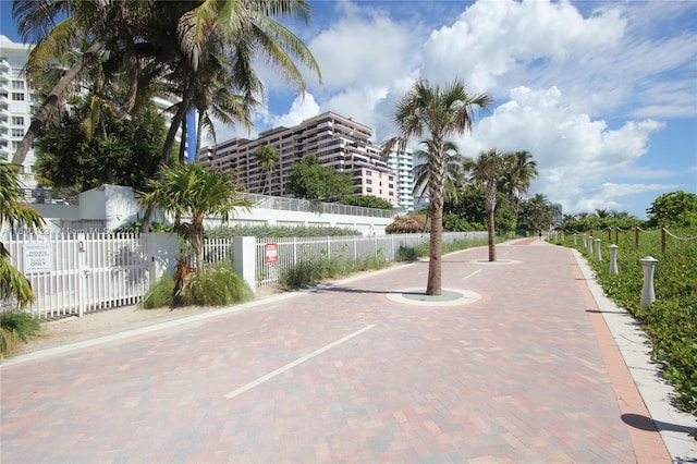 view of home's community with fence