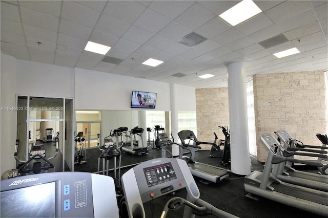 workout area with a paneled ceiling and visible vents