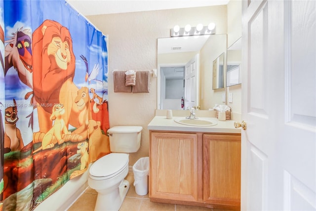 full bathroom featuring tile patterned floors, toilet, shower / bathtub combination with curtain, and vanity