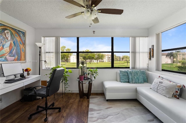 office space featuring ceiling fan, wood-type flooring, and a textured ceiling