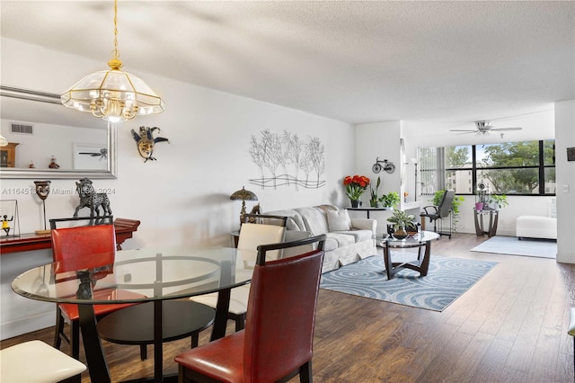 10207 Sunrise Lakes Blvd Unit 203, Sunrise, FL 33322 - living area featuring a chandelier, wood finished floors, a ceiling fan, and a textured ceiling