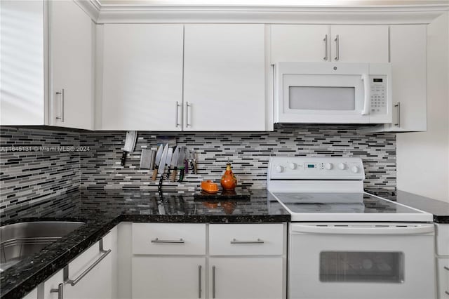 10207 Sunrise Lakes Blvd Unit 203, Sunrise, FL 33322 - kitchen with white appliances, white cabinetry, decorative backsplash, and dark stone counters