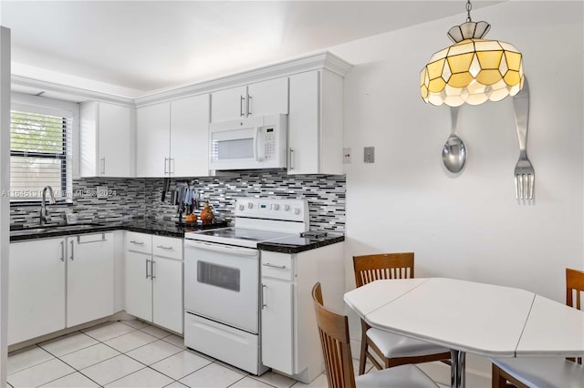 10207 Sunrise Lakes Blvd Unit 203, Sunrise, FL 33322 - kitchen with white appliances, backsplash, white cabinetry, pendant lighting, and light tile patterned flooring