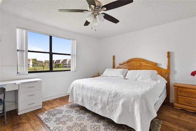 10207 Sunrise Lakes Blvd Unit 203, Sunrise, FL 33322 - bedroom with wood finished floors, a textured ceiling, and a ceiling fan