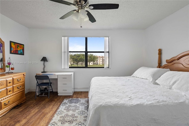 bedroom featuring a textured ceiling, ceiling fan, and hardwood / wood-style flooring