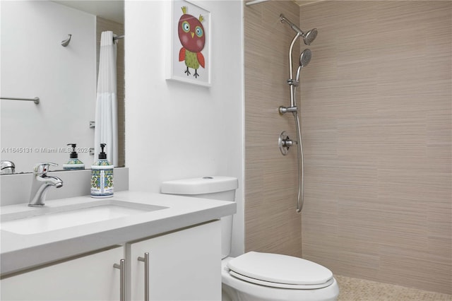 bathroom with a shower with curtain, vanity, and toilet