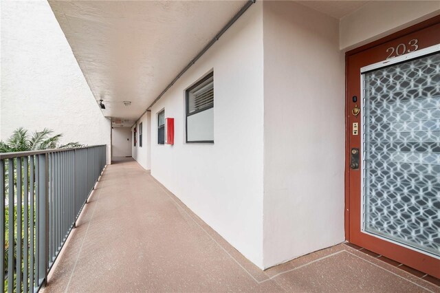 10207 Sunrise Lakes Blvd Unit 203, Sunrise, FL 33322 - entrance to property featuring stucco siding and a balcony