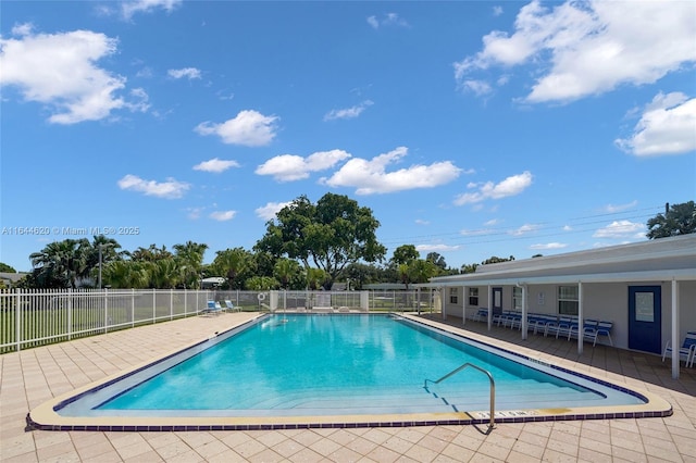 view of swimming pool featuring a patio area