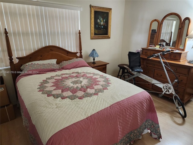 bedroom with light wood-type flooring