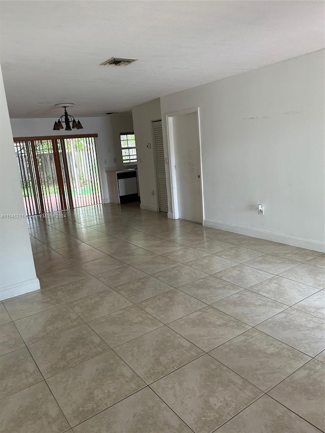 unfurnished living room featuring light tile patterned floors