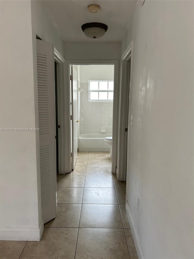 9136 NW 192nd Ter, Hialeah, FL 33018 - hall with light tile patterned flooring and baseboards