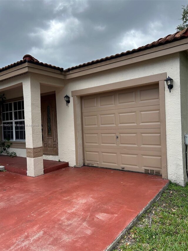 9136 NW 192nd Ter, Hialeah, FL 33018 - exterior space featuring stucco siding and concrete driveway