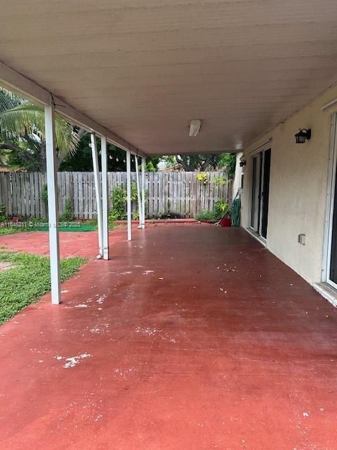 9136 NW 192nd Ter, Hialeah, FL 33018 - fenced backyard featuring a patio