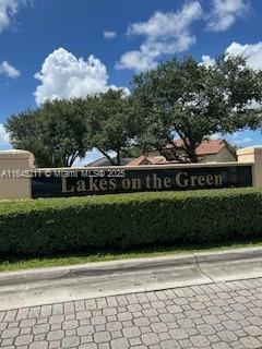 9136 NW 192nd Ter, Hialeah, FL 33018 - view of community / neighborhood sign