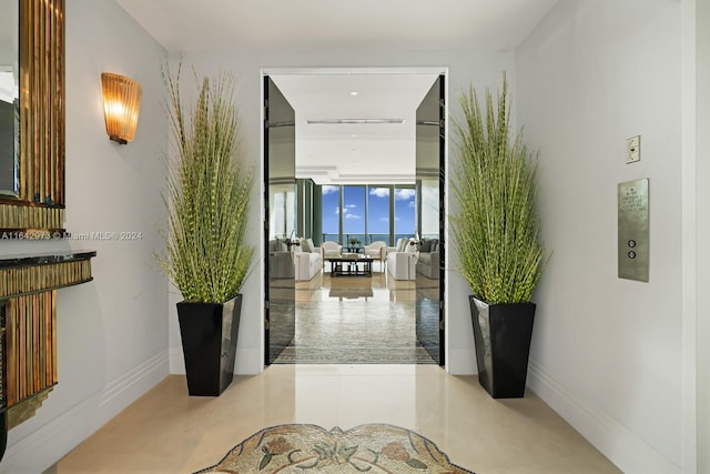 corridor with floor to ceiling windows