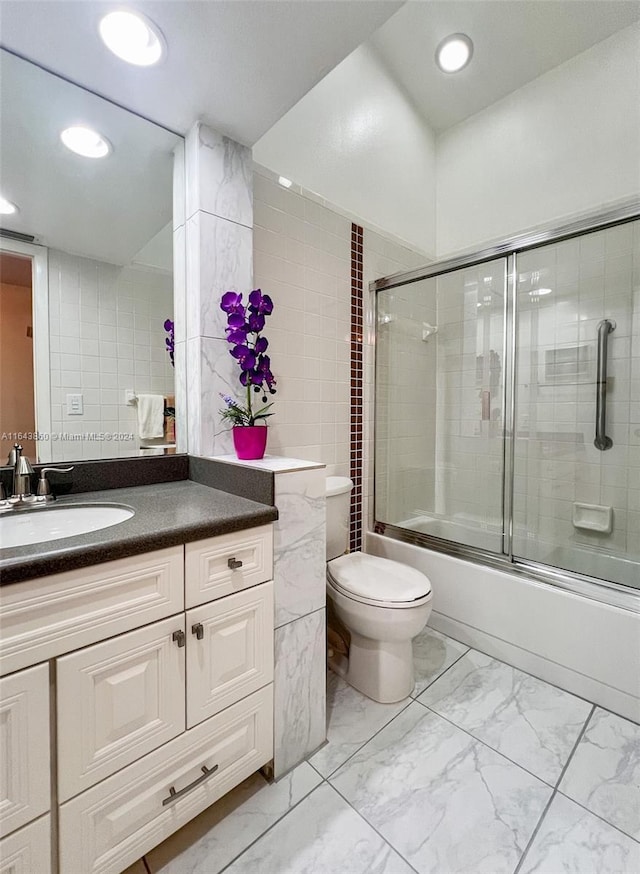 87200 Overseas Hwy Unit M4, Islamorada, FL 33036 - bathroom with recessed lighting, marble finish floor, combined bath / shower with glass door, toilet, and vanity