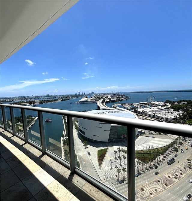 balcony featuring a water view