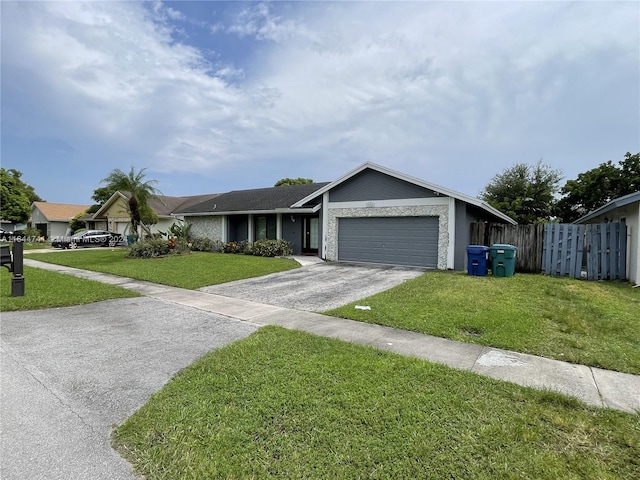 ranch-style home featuring a garage and a front lawn