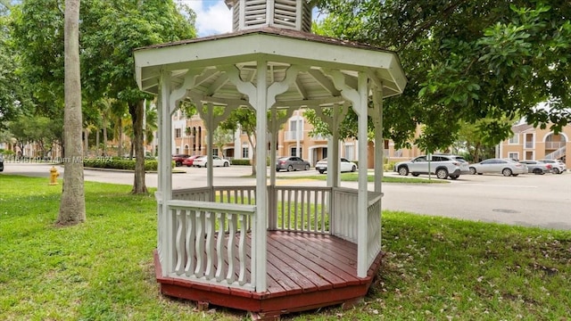 view of property's community with a yard and a gazebo