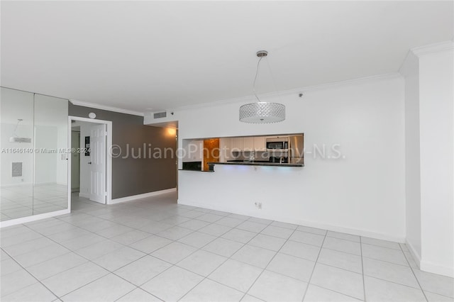 tiled spare room with ornamental molding