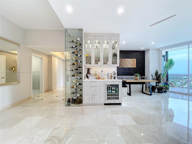 bar with beverage cooler and backsplash