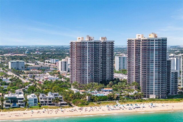 bird's eye view featuring a water view and a view of the beach