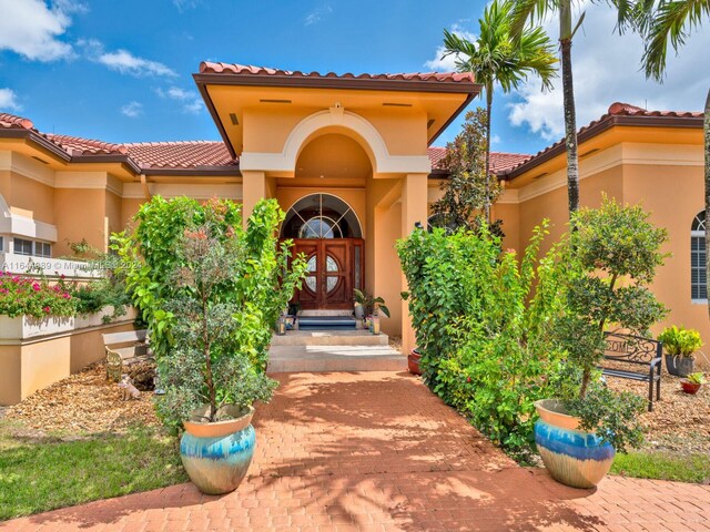175 SW 132nd Ave, Miami, FL 33184 - entrance to property featuring a tile roof and stucco siding