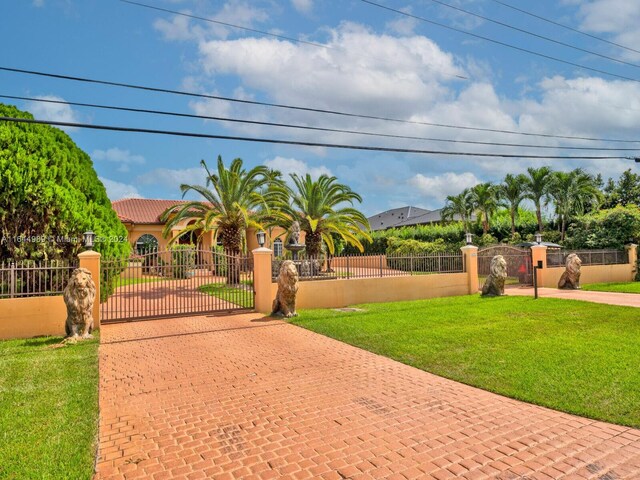175 SW 132nd Ave, Miami, FL 33184 - mediterranean / spanish home featuring decorative driveway, a gate, and stucco siding