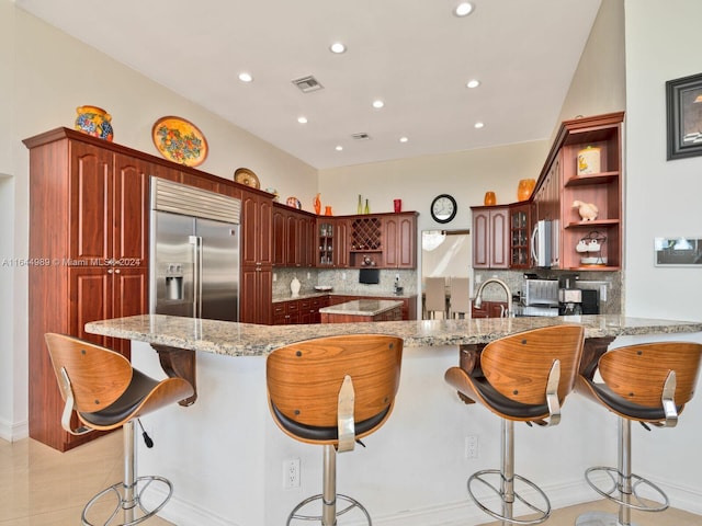 175 SW 132nd Ave, Miami, FL 33184 - kitchen with appliances with stainless steel finishes, open shelves, a peninsula, decorative backsplash, and recessed lighting