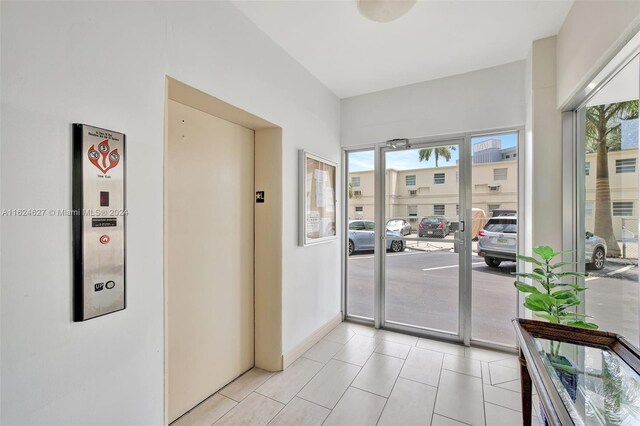 doorway featuring light tile patterned floors