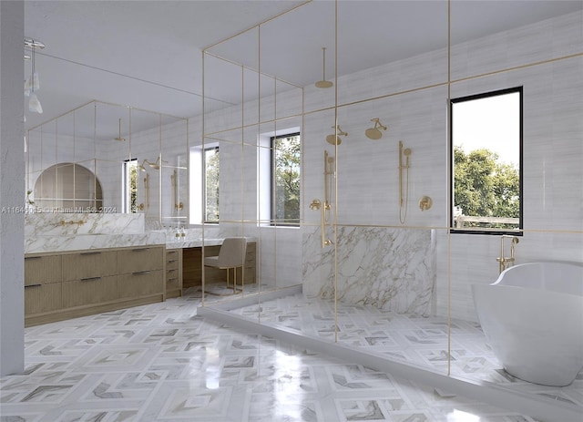 bathroom with vanity, tile walls, and separate shower and tub