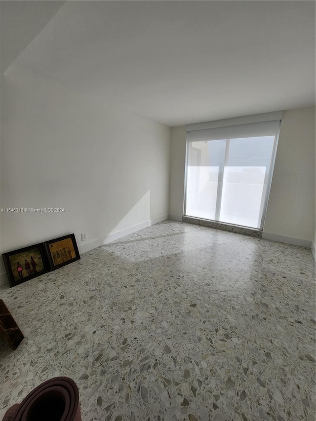 2555 Collins Ave Unit 306, Miami Beach, FL 33140 - empty room with baseboards
