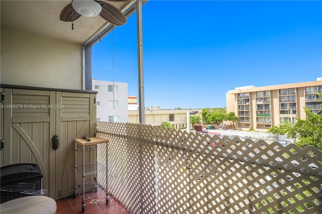 exterior space featuring a balcony and ceiling fan