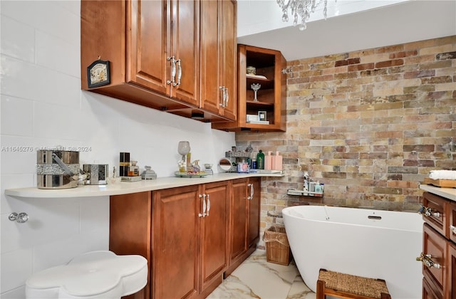 bathroom with a washtub and vanity