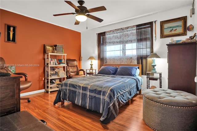 bedroom featuring ceiling fan and hardwood / wood-style flooring