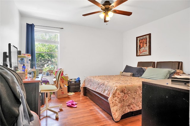 bedroom featuring ceiling fan and wood-type flooring