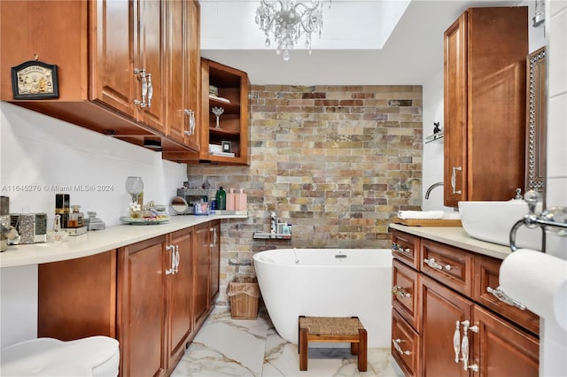 kitchen featuring sink, decorative backsplash, and a skylight