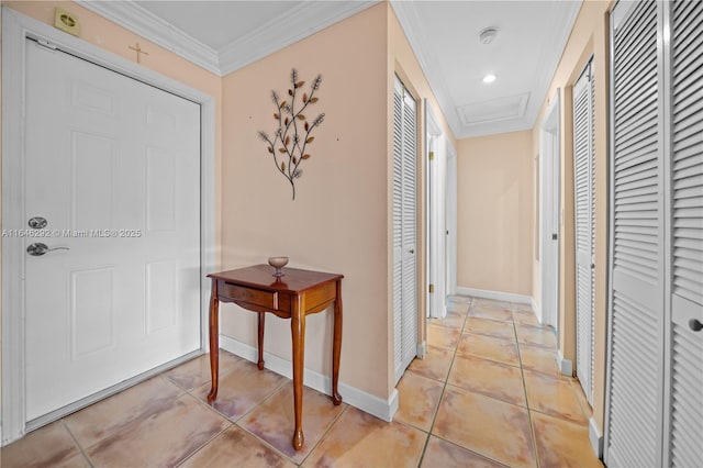 corridor with light tile patterned floors and ornamental molding