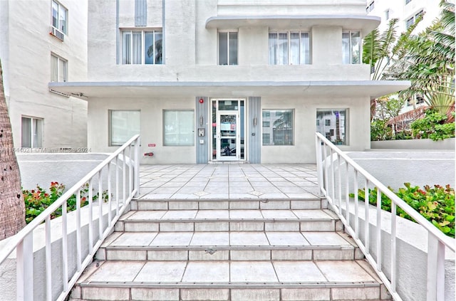 doorway to property with a patio area