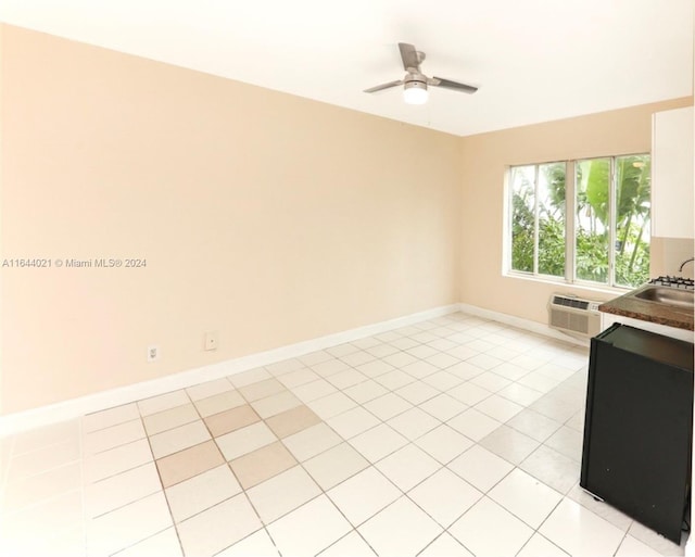 interior space featuring ceiling fan, light tile patterned floors, sink, and a wall mounted AC