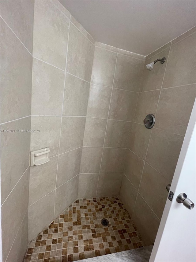 bathroom with tiled shower