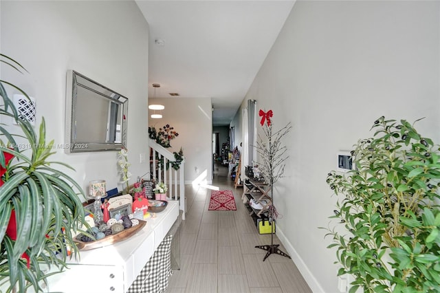 hallway with light tile patterned flooring