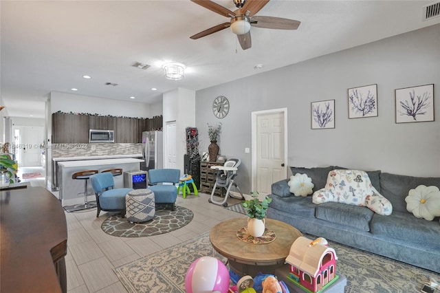 living room featuring ceiling fan