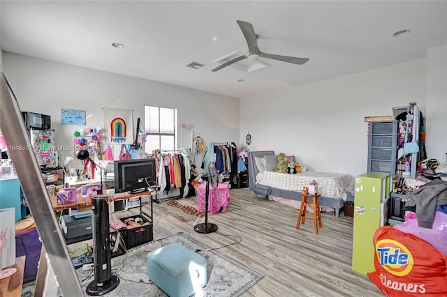 game room with ceiling fan and light hardwood / wood-style floors