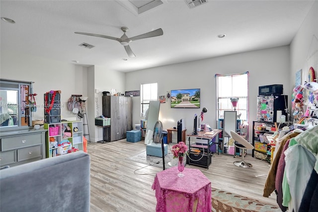 interior space featuring plenty of natural light, light hardwood / wood-style flooring, and ceiling fan