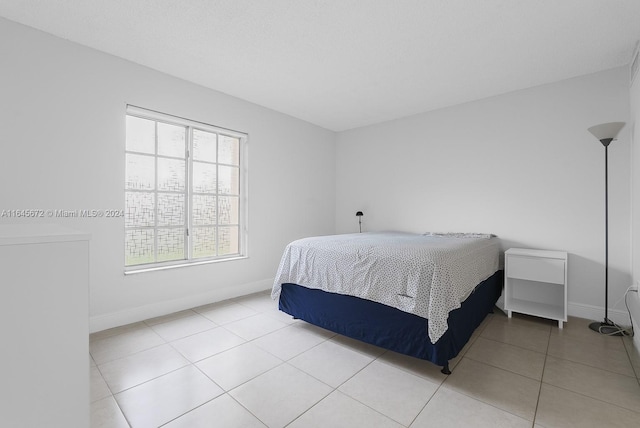 bedroom featuring light tile patterned floors