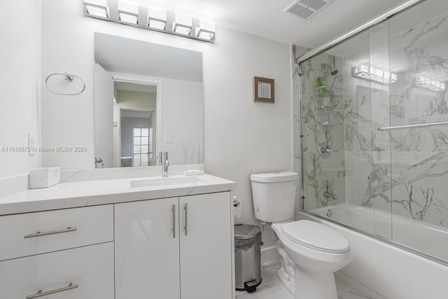 full bathroom with tile patterned floors, toilet, vanity, and enclosed tub / shower combo